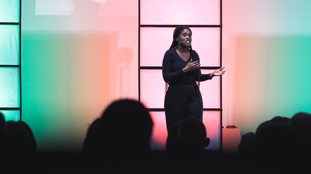 woman speaking on stage